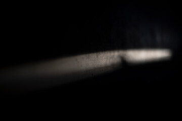 Line of light on the wall. Beam on the surface. Light and shadow.