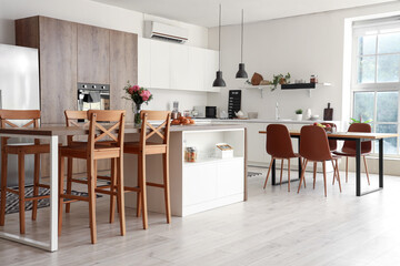 Interior of kitchen with counters and tables