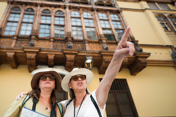 Tourist pointing to a place with his hand.