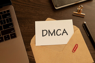 There is word card with the word DMCA. It is an abbreviation for Digital Millenium Copyright Act as eye-catching image.
