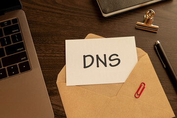 There is word card with the word DNS. It is an abbreviation for Domain Name System as eye-catching image.