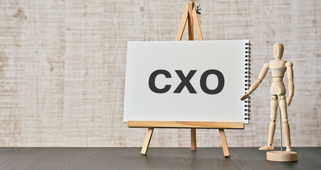 There is notebook with the word CXO. It is an abbreviation for Chief user eXperience Officer as...