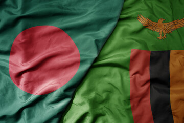 big waving national colorful flag of zambia and national flag of bangladesh.
