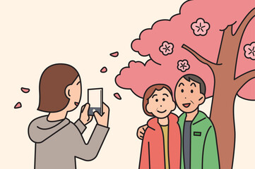 a daughter is taking pictures of her parents in front of the cherry blossom tree. cartoon style illustration. 