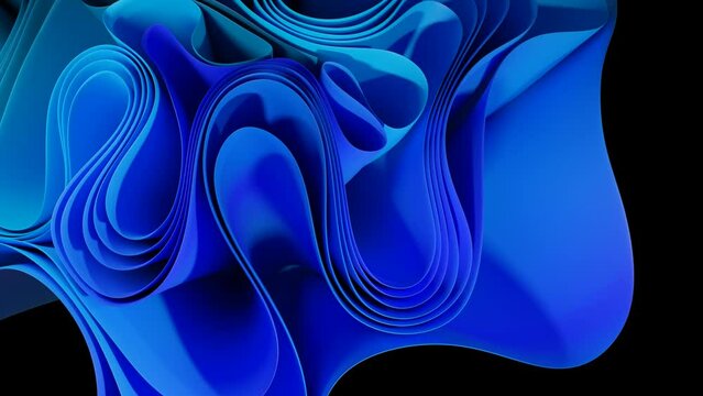 Moving curved sheets of paper in blue and green, isolated on black. Copy space at the end of the video.