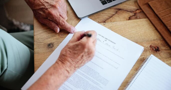 Elderly person, paper and pen with signature for life insurance, will and testament on table. Retirement, pensioner and writing on document for pension fund, estate planning or investment at home