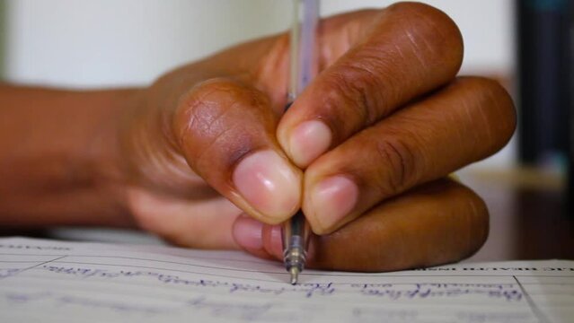 Female hand writing with pen on logbook page close up 2