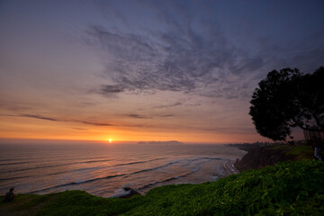 Miraflores, a district located in Lima, Peru, offers breathtaking sunset views along its coastline...