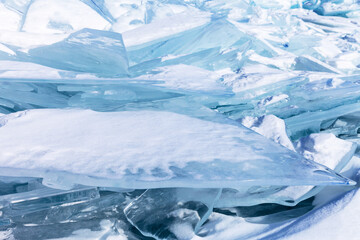 Winter cold natural background with pile of ice floes on frozen sea. Blue snowy flat ice floe can...