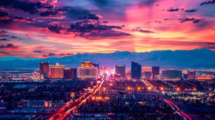 Papier Peint photo Etats Unis A cityscape with a large tower in the background. The sky is a mix of colors, including red and blue. The city is lit up with neon lights, creating a vibrant and lively atmosphere