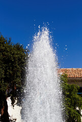 Naklejka premium Water Spraying Into Air From Plaza Fountain Cusco Peru