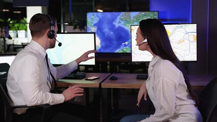 Successful team of dispatchers track on the map of cargo transportation