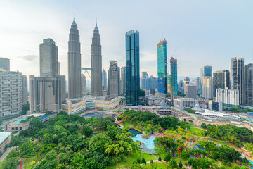 Kuala Lumpur skyline. Aerial view of a green city park