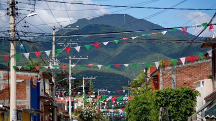 Colorful pennant flags flying over a street in Santa Maria del Tule, Oaxaca, Mexico