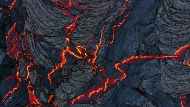 A 4K drone captures aerial cinematic close-up shots of both lava stones and the live lava flowing in between them.