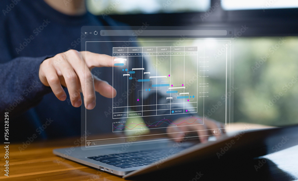 Fototapete project planner in software, updating and managing milestones on a timeline Gantt chart in technology online. schedule plan management work update and workflow. concept appointment staff of business