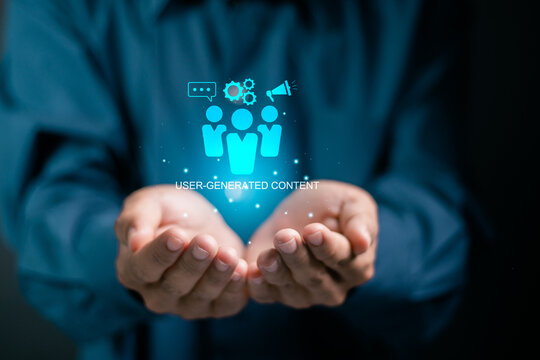 UGC, User generated content concept. Online marketing, Product reviews from the perspective of real users. Businessman holding UGC icon on virtual screen..