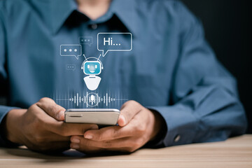 AI Chatbot intelligent digital customer service. Artificial intelligence automatically respond to online messages to help customers instantly. Businessman use smartphone with robotic icon for chatbot.