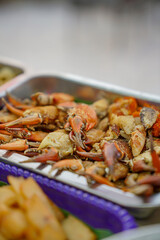 Sea crab for additional crab noodles in a stainless steel tray