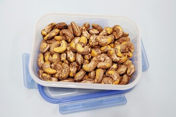 Roasted cashew nuts in plastic containers