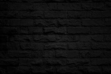 spotlight on black brick wall