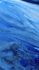Glitter fluid wave. Paint background. Blur blue color gradient shimmering metallic ink gloss spill flow cascade abstract art texture.