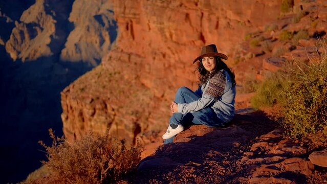 Young woman is fascinated by the breathtaking view over the Grand Canyon - travel photography