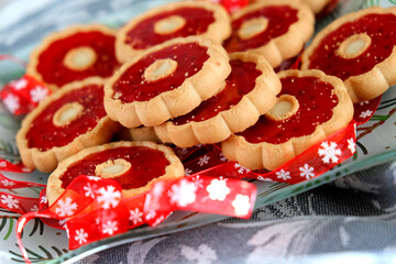 Thumbprint breakfast cookies with raspberry jam. Homemade freshly baked shortbread cookies, Christmas atmospheric mood. Happy New Year