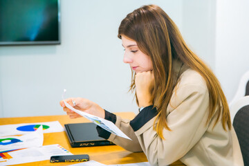 Group of marketing professionals having a meeting. Creative business team brainstorming with sticky notes. Happy business people putting their ideas together as they plan a project.