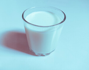 Glass of milk fresh full with calcium and vitamins protein and lactose pure white dairy-milk drink liquid food for children in a transparent-glass closeup image picture stock photo 
