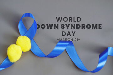 World Down Syndrome Day with blue ribbon and yellow bubbles