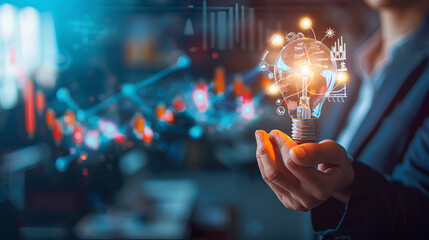 Businessman holding creative light bulb with growth graph, analytics icons. Utilizing analytics technology to develop new strategies and insights that enhance successful performance in global business - obrazy, fototapety, plakaty