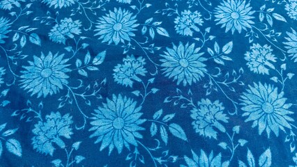 Brightly colored fabrics have blue and blue patterns, floral prints, textiles, bright patterns.