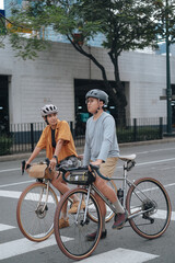 Fototapeta premium A young couple riding their bikes in the city.