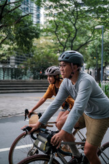 Fototapeta na wymiar A young couple riding their bikes in the city.