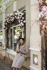 Woman Standing in Front of Flower Shop