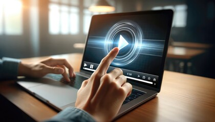 Close up of a user's hands poised to play a video, with a streaming service interface visible on a laptop screen.
