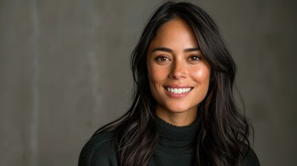 Fototapeta premium Woman with captivating smile wearing a cozy dark sweater.