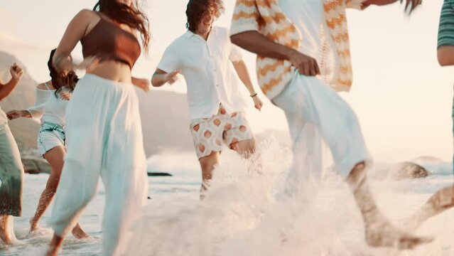 Friends, group or running on beach for travel with bonding, happiness or playing on vacation or holiday in Cape Town. Women, men and energy with seaside trip in summer with diversity, laughing or fun