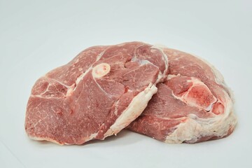 Raw meat on a white background. Pork, beef or lamb. Steak or tenderloin. Different parts of meat products for different dishes.