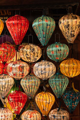 Brightly colourful lanterns hanging along a string