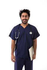 Male Indian healthcare worker wearing a dark blue Scrubs.