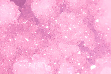 Amethyst pink crystals. Gems. Mineral crystals in the natural environment. Texture of precious and semiprecious stones. Seamless background with copy space colored shiny surface of precious stones.