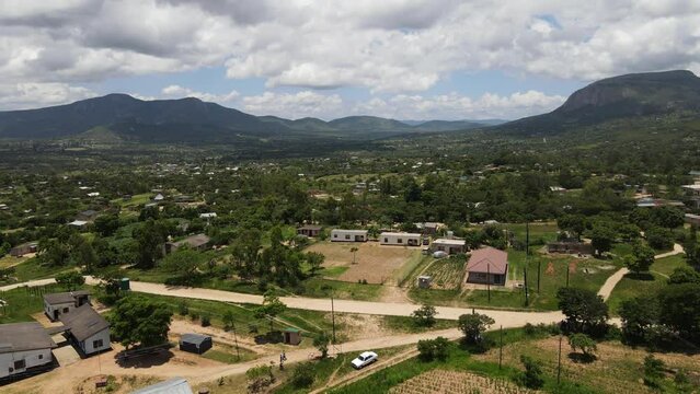 Rural Mutare, Zimbabwe. Mountains backdrop. Captures scenic beauty and community essence.