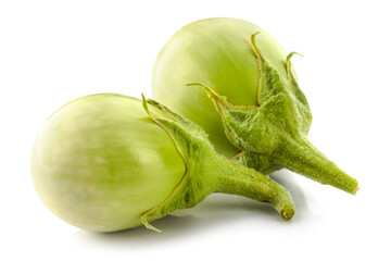 Raw green round eggplant vegetable isolated on a white background