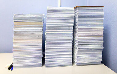 Stacks of papers on a table in the office - 756204873