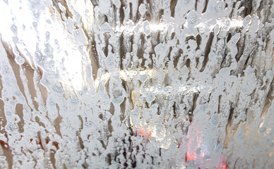 Car glass at a car wash In drops of water. Background - 756205005