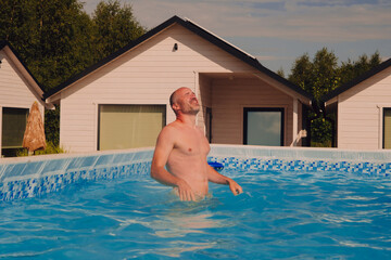 A man having fun in a pool