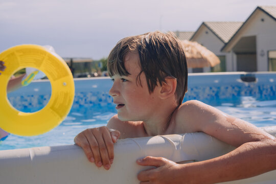 Boy happy swimming in a pool