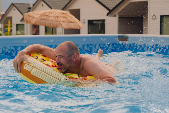 A man having fun in a pool